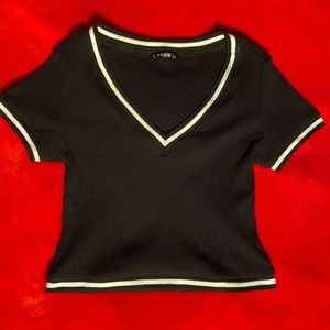 black crop top with white detail.